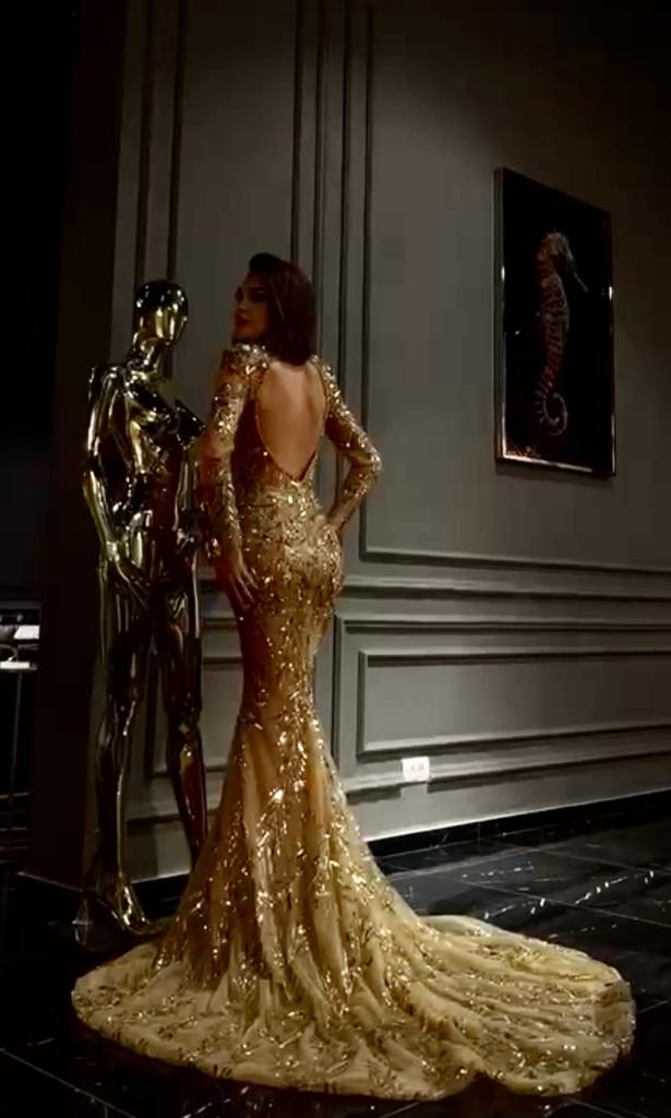 GOLD BEADED LONG SLEEVE OPEN BACK GOWN