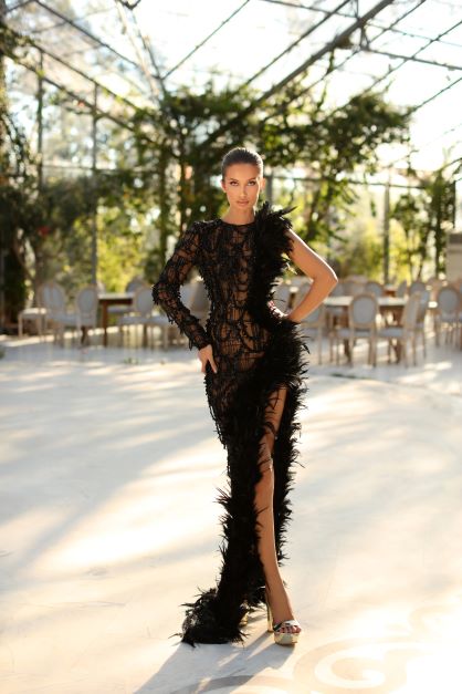 ASYMMETRICAL BEADED BLACK GOWN WITH FEATHER FEATURE